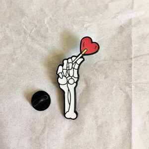 3/$15 Brand New Skeleton Hand Holding Cartoon Candy Heart Enamel Pin 1.75”